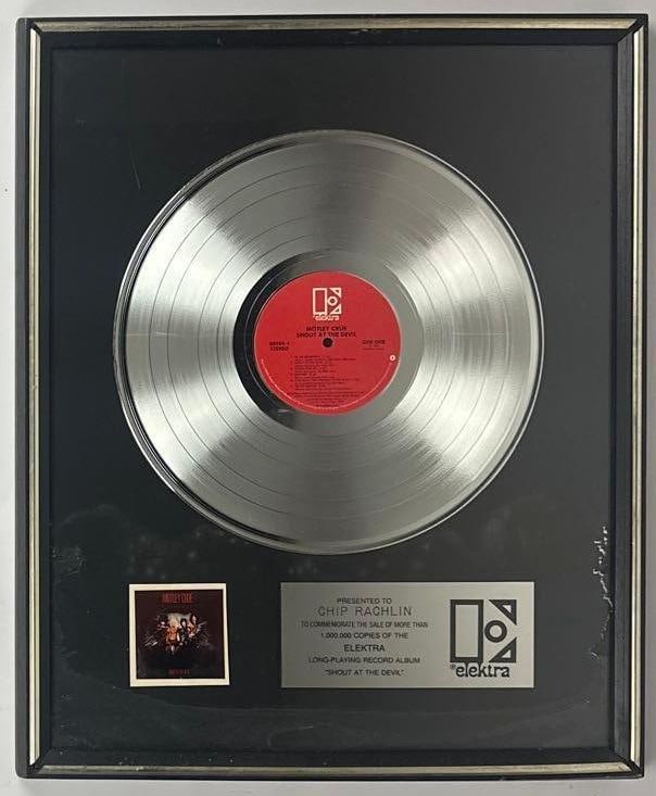 Motley Crue "Shout at the Devil" RIAA Platinum Sales Award Presented to Chip Rachlin: RIAA Certified Platinum Sales Award presented to Chip Rachlin to commemorate the sale of more than 1,000,000 copies of the Elektra Records album "Shout at the Devil" by Motley Crue. The framed display