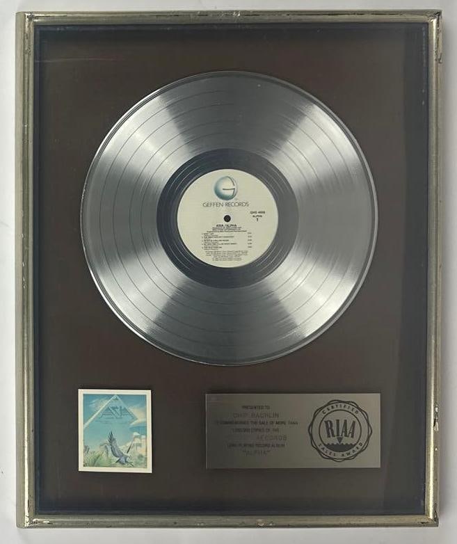 Asia "Alpha" RIAA Platinum Sales Award Presented to Chip Rachlin: RIAA Certified Platinum Sales Award presented to Chip Rachlin to commemorate the sale of more than 1,000,000 copies of the Geffen Records album "Alpha" by Asia. The framed display, measuring approxima
