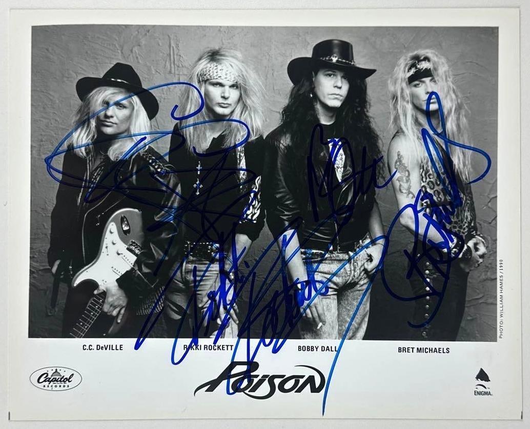 Poison Group Signed 8" x 10" Promo Photo (4 Sigs) (JSA Authentication): Black-and-white 8" x 10" promotional photo signed in blue felt tip marker by Poison band members Bret Michaels, Bobby Dall, Rikki Rockett, and C.C. Deville. In fine condition. Authenticated by JSA.