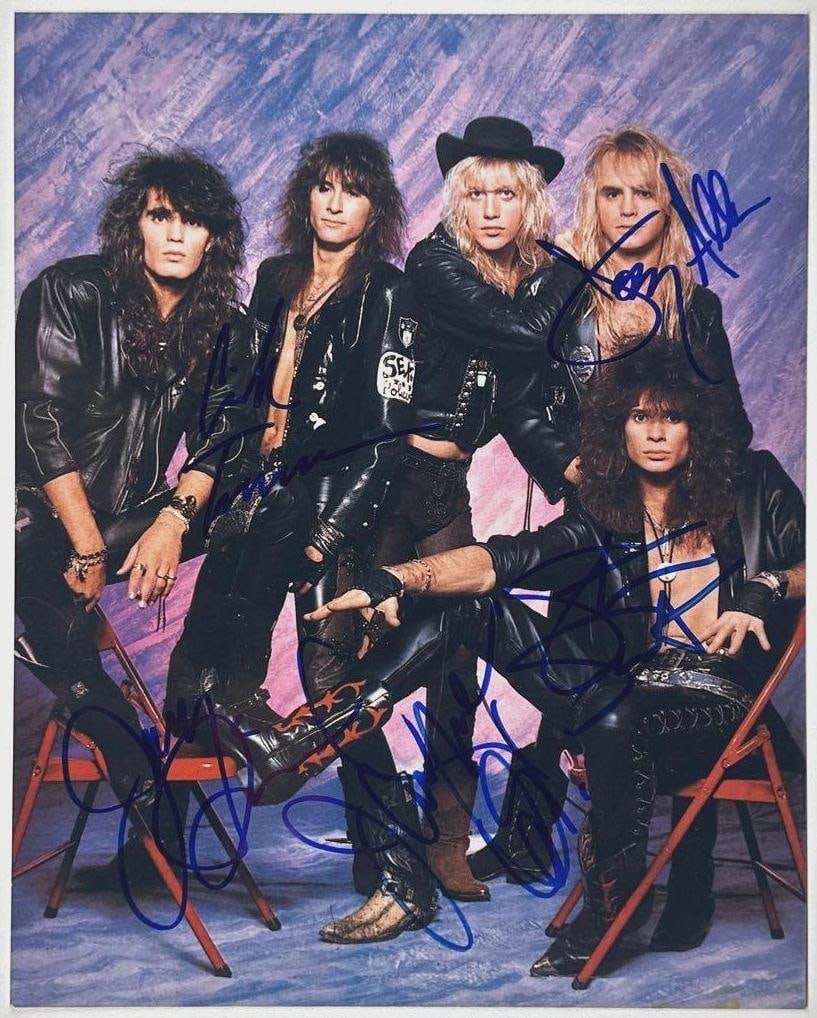 Warrant Group Signed 10" x 8" Photo (5 Sigs) (JSA Authentication): Color 10" x 8" photo signed in blue felt tip marker by Warrant band members Erik Turner, Joey Allen, Jani Lane, Jerry Dixon, and Steven Sweet. In fine condition. Authenticated by JSA. Provenance This