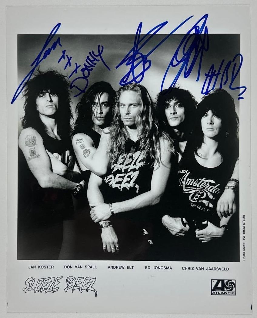 Sleeze Beez Group Signed 10" x 8" Promo Photo (5 Sigs) (Third Party Guaranteed): Black-and-white 10" x 8" promotional photo signed in blue felt tip marker by Sleeze Beez band members Jan Koster, Don Van Spall, Andrew Elt, Ed Jongsma, and Chriz Van Jaarsveld. In fine condition.