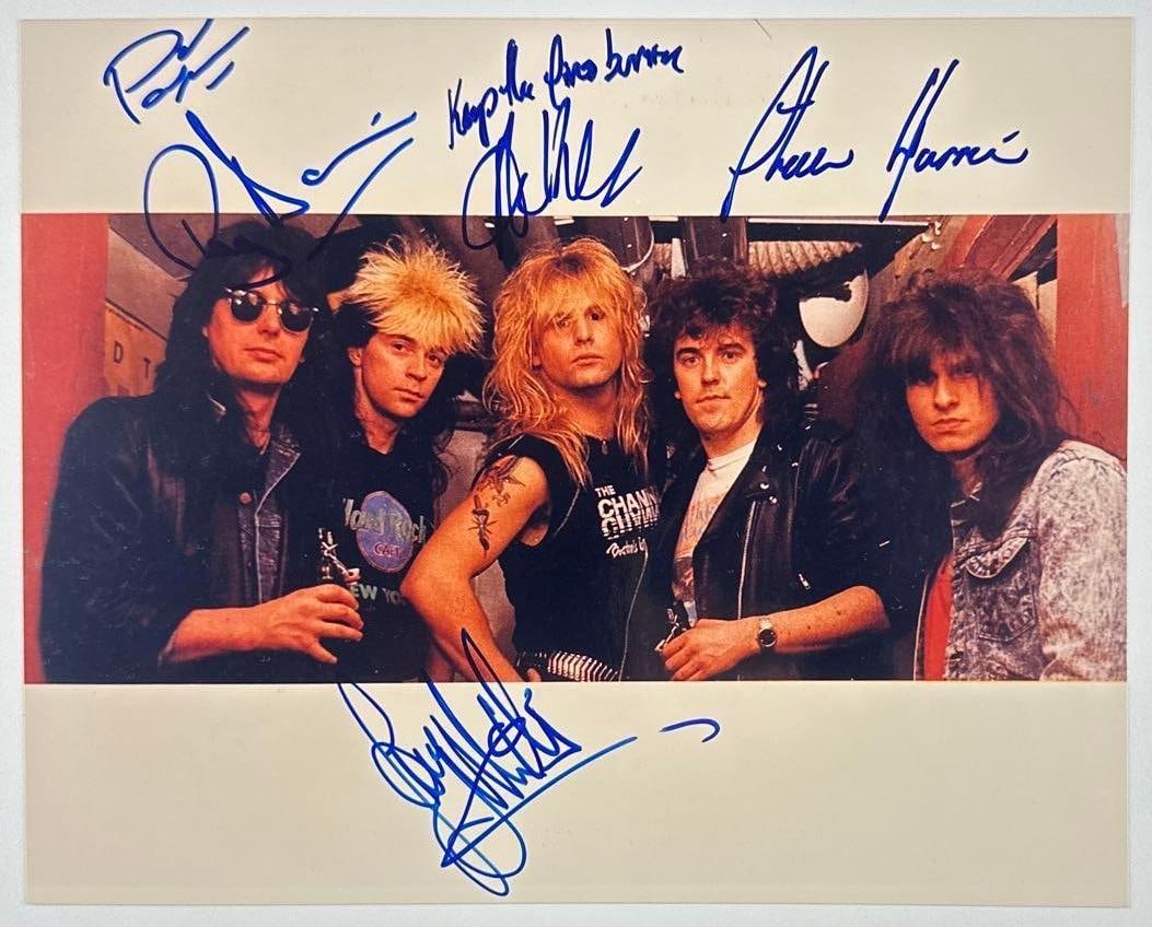 Shy Group Signed 8" x 10" Photo (5 Sigs) (Third Party Guaranteed): Color 8" x 10" photo signed in blue felt tip marker by all five Shy band members. In fine condition. Provenance Eaton & Brennan Auctions guarantees this lot to pass Third-Party Authentication. Please