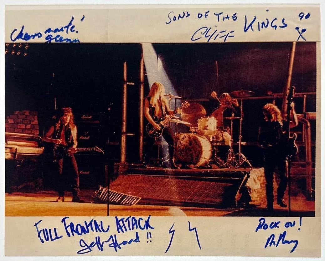 Kings of the Sun Group Signed 8" x 10" Photo (4 Sigs) (Third Party Guaranteed): Color 8" x 10" photo signed in blue felt tip marker by Kings of the Sun band members Jeffrey Hoad, who inscribed "Full Frontal Attack!!" before his signature, Clifford Hoad, who inscribed "Sons of