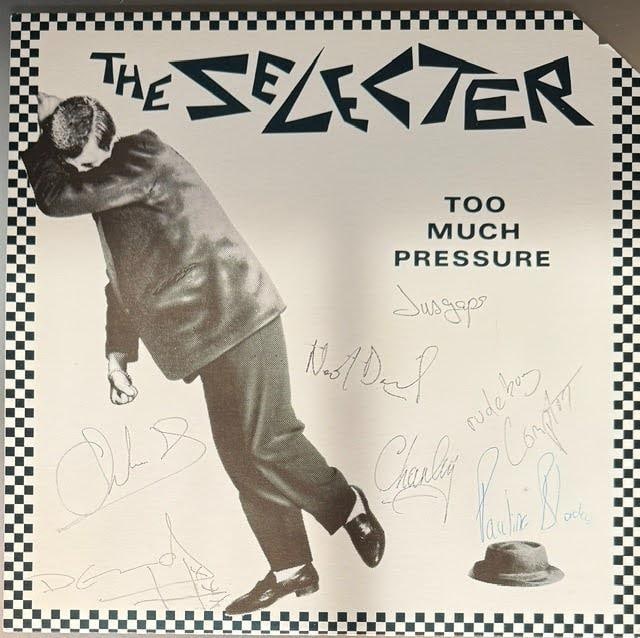 The Selecter Group Signed "Too Much Pressure" Album (7 Sigs) (Third Party Guaranteed): "Too Much Pressure" album signed on the cover in black and blue ballpoint pens by The Selecter band members Neol Davies, Pauline Black, Charley Anderson, Compton Amanor, and more. Measuring approximat