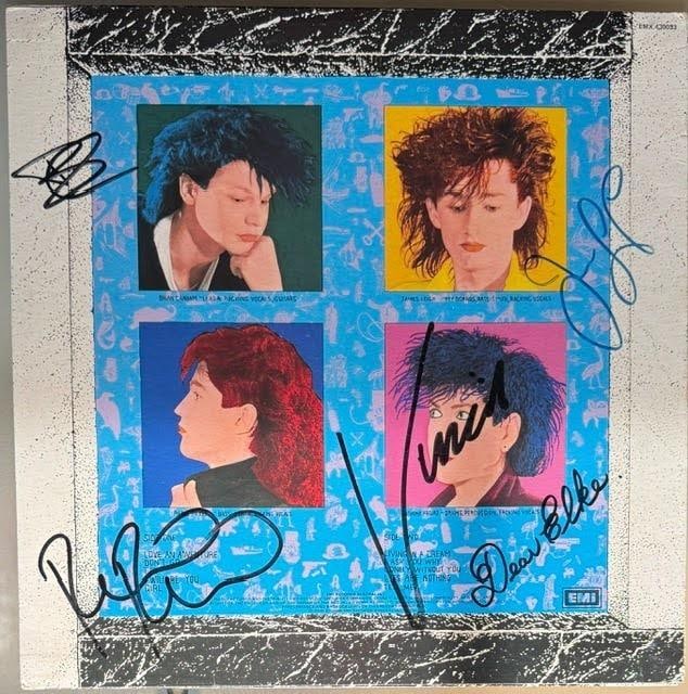 Pseudo Echo Group Signed "Love an Adventure" Australian Album (4 Sigs) (Third Party Guaranteed): Fully signed on the back cover with a dedication, signatures placed directly over the printed band photos (band lineup at the time: Brian Canham, James Leigh, and two other members). Individual