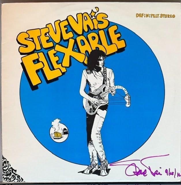Steve Vai Signed "Flex-able" Album (Third Party Guaranteed): "Flex-able" album signed on the cover in purple felt tip marker by musician Steve Vai, who inscribed the date "9/10/14" after his signature. Measuring approximately 12" x 12", the jacket is in good co