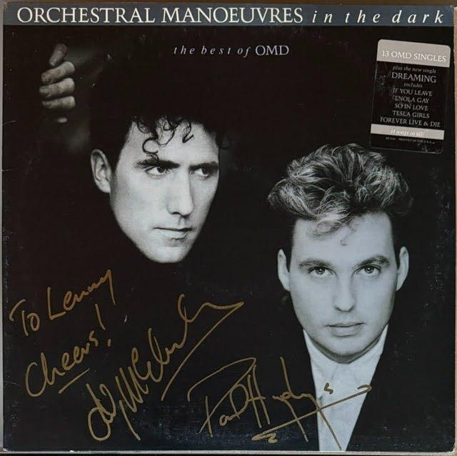 Orchestral Manoeuvers in the Dark Group Signed "The Best of OMD" Album (2 Sigs) (Third Party): Album fully signed on the front cover in gold marker by Andy McCluskey, who inscribed "To Lenny Cheers!" before his signature, and Paul Humphreys. Measuring approximately 12" x 12", the jacket is in