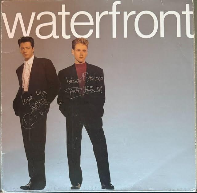 Waterfront Fully Group Signed "S/T" Album (2 Sigs) (Third Party Guaranteed): "Waterfront" album signed on the cover in silver felt tip marker by Waterfront band members Chris Duffy, who inscribed "love ya loads!" before his signature, and Phil Cilia, who inscribed "lots of