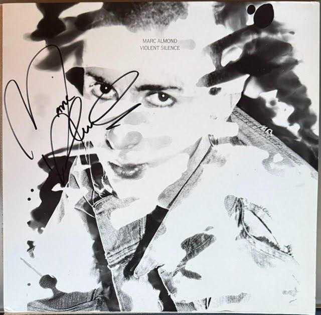 Marc Almond Signed "Violent Silence" Album Single (Third Party Guaranteed): "Violent Silence" album single signed on the cover in black felt tip marker by musician Marc Almond. Measuring approximately 12" x 12" and in good condition with light general wear. Record is