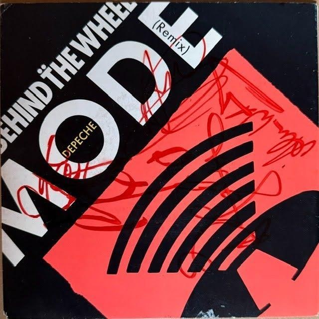 Depeche Mode Group Signed "Behind The Wheel" Remix 45 (Epperson LOA): "Behind the Wheel" remix 45 single signed on the cover in red felt tip marker by Depeche Mode band members Alan Wilder, Dave Gahan, Martin Gore, and Andrew Fletcher. Measuring approximately 7" x 7", t