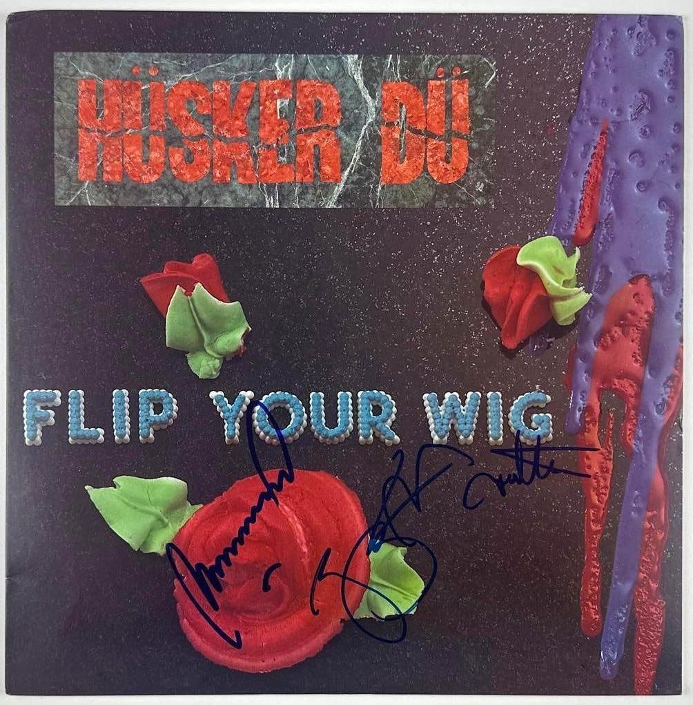 Husker Du Fully Group Signed "Flip Your Wig" Album (3 Sigs) (JSA Authentication): "Flip Your Wig" album signed on the cover in blue felt tip marker by Husker Du band members Bob Mould, Greg Norton, and Grant Hart. Measuring approximately 12" x 12" and in fine condition. Record is