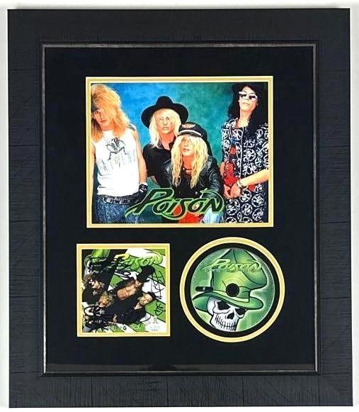 Poison Group Signed "Power to the People" CD Framed Display (4 Sigs) (JSA Authentication): "Power to the People" CD framed display signed on the cover in black felt tip marker by Poison band members C.C. Deville, Bret Michaels, Rikki Rockett, and Bobby Dall. Signed CD measures