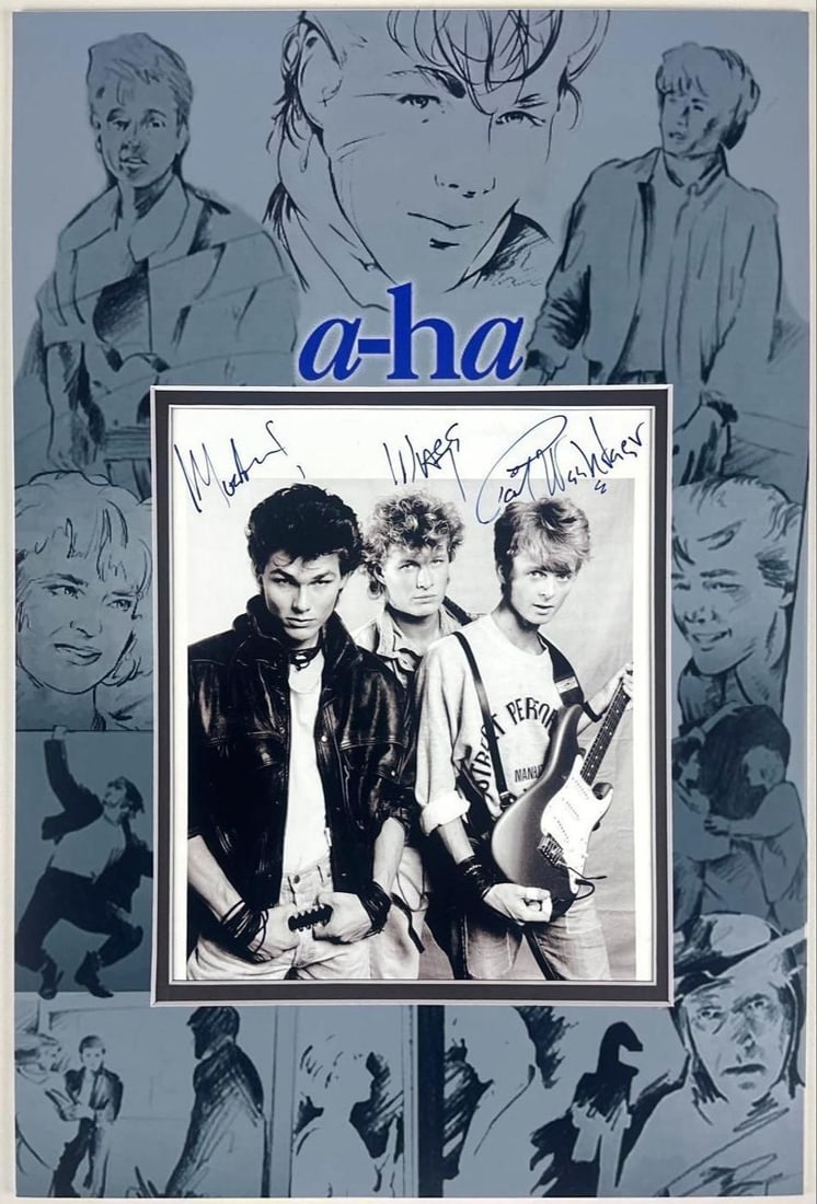 A-ha Fully Group Signed 9" x 7.5" Photo (3 Sigs) (Third Party Guaranteed): Color 18" x 12" collage of clips from the "Take On Me" music video matted with a black-and-white 9" x 7.5" photo signed in black felt tip marker by A-ha band members Paul Waaktaar-Savoy, Magne