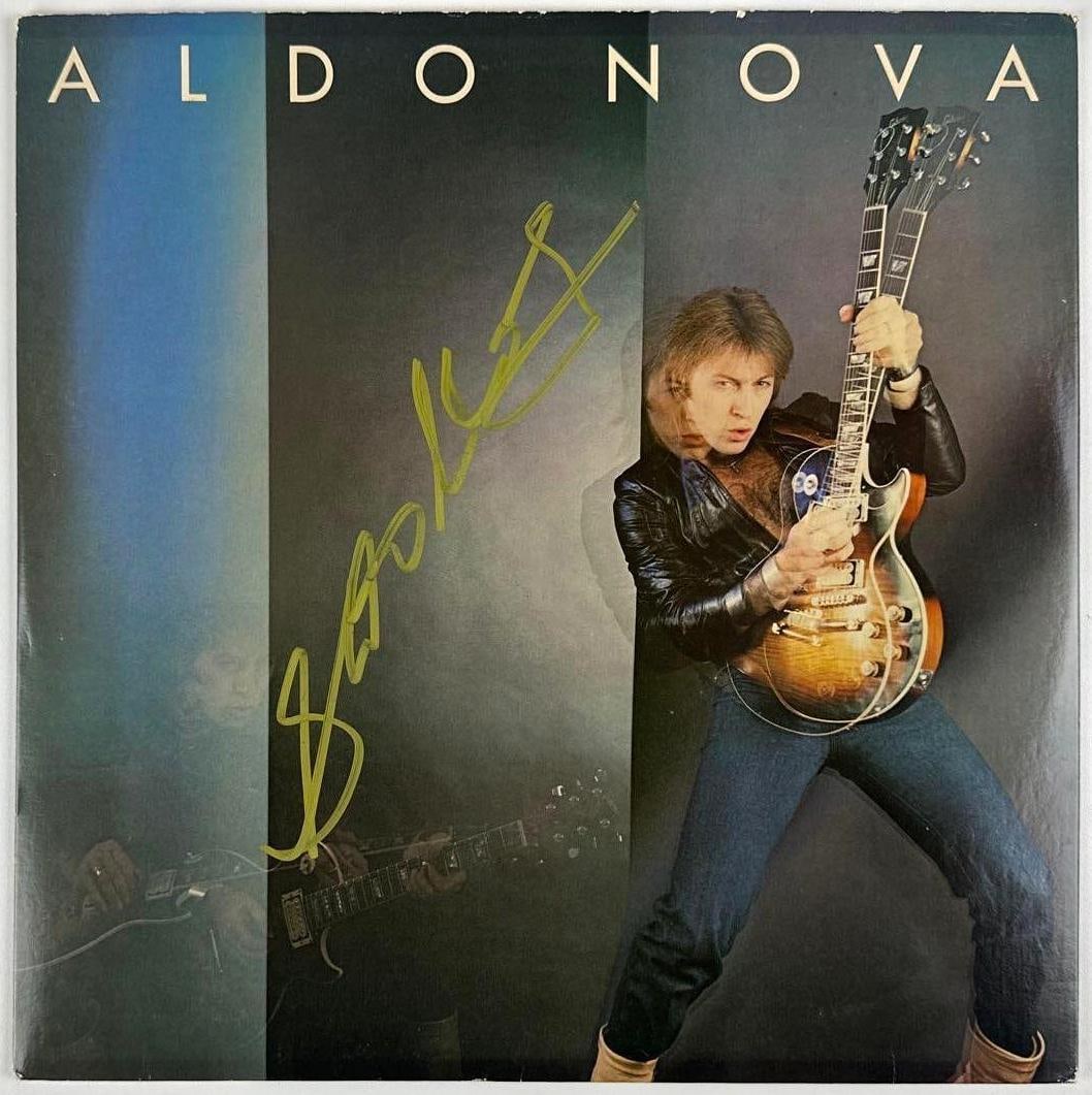 Aldo Nova Signed "S/T" Album (Beckett Authentication): "Aldo Nova" album signed on the cover in gold felt tip marker by musician Aldo Nova. Measuring approximately 12" x 12" and in fine condition. Record is included. Authenticated by Beckett, with their