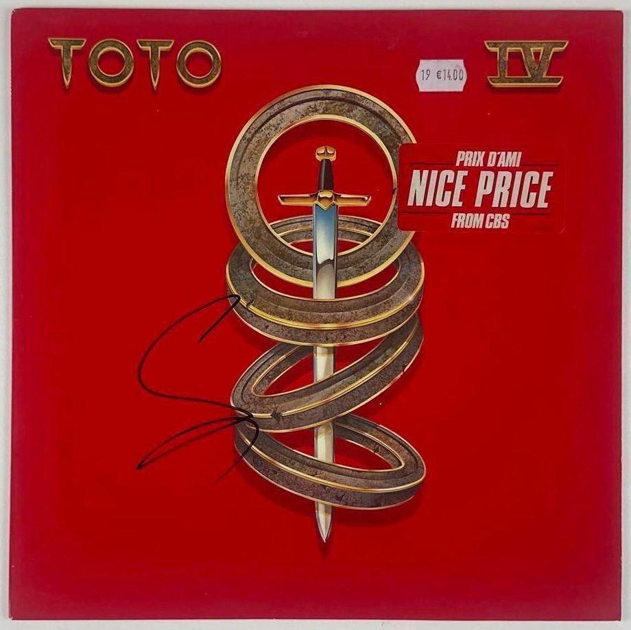 Toto: Steve Lukather Signed "Toto IV" Album (Beckett Authentication): "Toto IV" album signed on the cover in black felt tip marker by Toto guitarist and vocalist Steve Lukather. Measuring approximately 12" x 12" and in good condition with some signs of light scattered