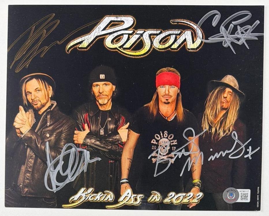 Poison Group Signed 8" x 10" "Kicking Ass in 2022" Promo Photo (4 Sigs) (Beckett): Color 8" x 10" "Kicking Ass in 2022" promotional photo signed in silver and gold felt tip marker by Poison band members Bret Michaels, C.C. DeVille, Rikki Rockett, and Bobby Dall. In fine condition.