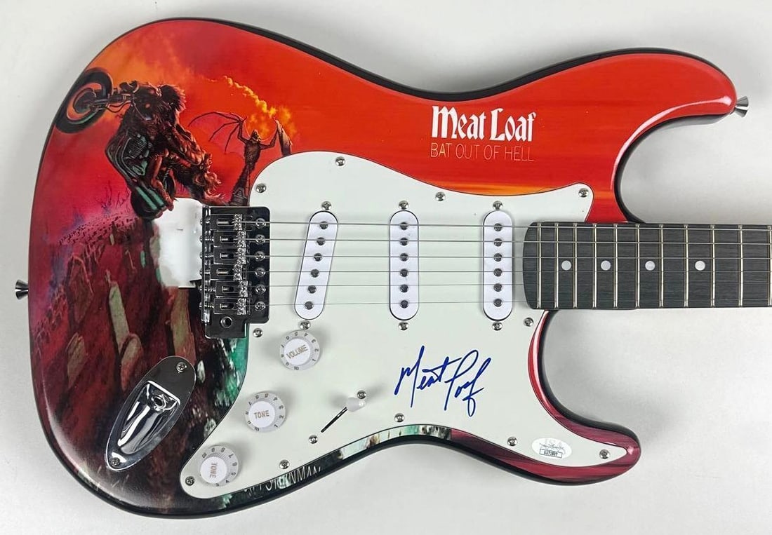 Meat Loaf Signed "Bat Out of Hell" Custom Graphics Stratocaster-Style Guitar (JSA): "Bat Out of Hell" custom graphics Stratocaster-style guitar signed on the pickguard in blue felt tip marker by musician Meat Loaf. Measuring approximately 39" x 13" and in fine condition. Accompanied