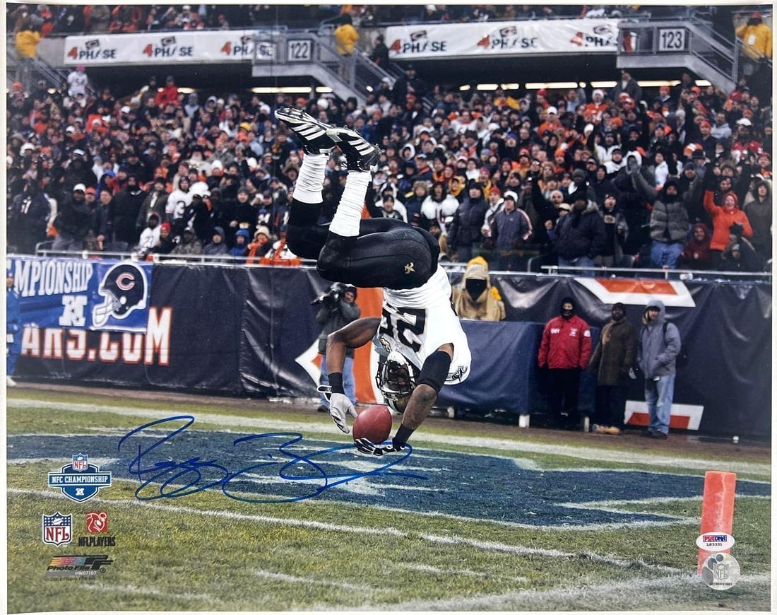 Reggie Bush Signed 16" x 20" Photo (PSA/DNA Authentication): Color 16" x 20" photo signed in blue felt tip marker by NFL football player Reggie Bush. In fine condition. Accompanied by a PSA/DNA COA (#L83331).