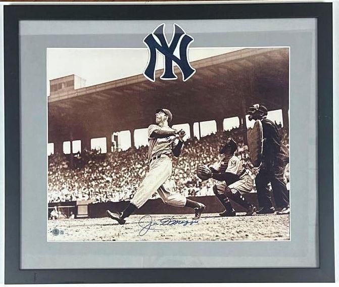 Joe DiMaggio Signed 15.75" x 19.75" Photo Framed Display (Beckett): Black-and-white 15.75" x 19.75" photo signed in blue ballpoint pen by New York Yankees baseball player Joe DiMaggio. Signed photo measures 15.75" x 19.75" and is displayed in a frame measuring 22.75" 