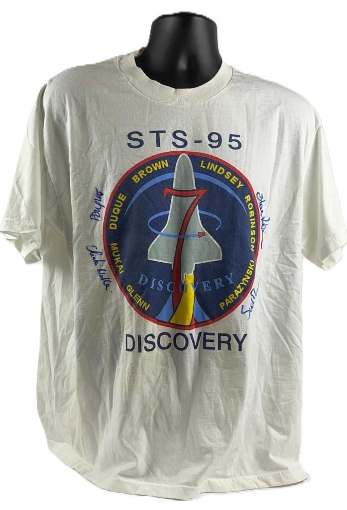 STS - 95 Discovery Space Shuttle Mission Multi-Signed T-Shirt (4 Sigs) (Third Party Guaranteed): White, adult large 29.25" x 21.25" t-shirt signed on the front in blue felt tip marker by astronauts Chiaki Mukai, Steve Robinson, and two others. In very good condition, with some signs of scattered
