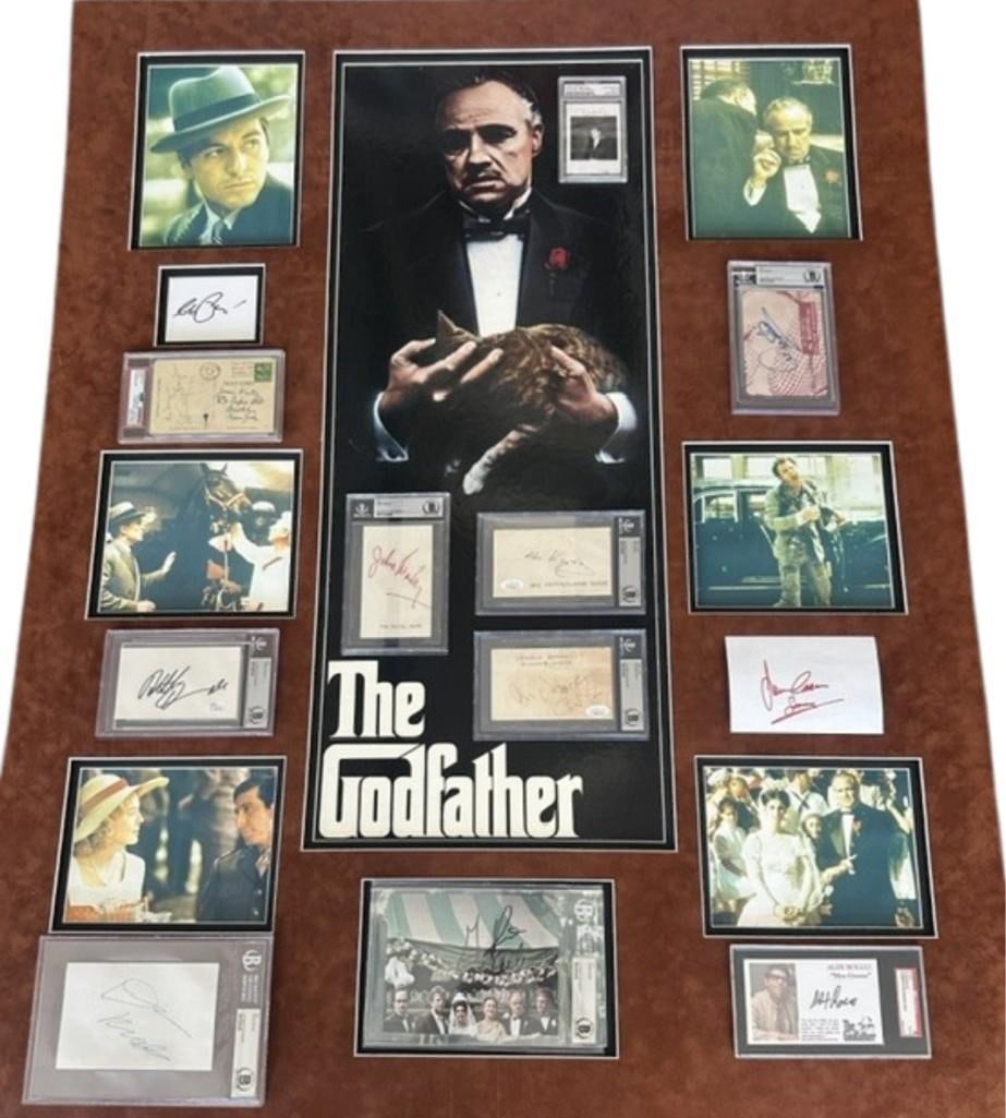 Godfather Impressive Cast Signed 50" x 40" Matted Display (11 Sigs): Large 50" x 40" matted display of (11) signed cuts and photos from the 1972 film "The Godfather." The autographs are arranged around a central photo of the main character Don Vito Corleone, the