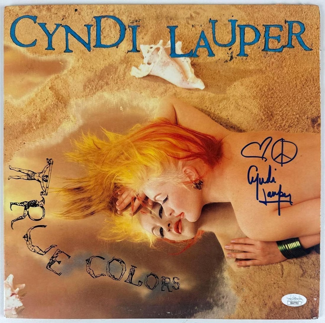 Cyndi Lauper Signed "True Colors" Album (JSA Authentication): "True Colors" album signed on the cover in blue felt tip marker by musician Cyndi Lauper. Measuring approximately 12" x 12" and in fine condition. Record is included. Accompanied by a JSA COA