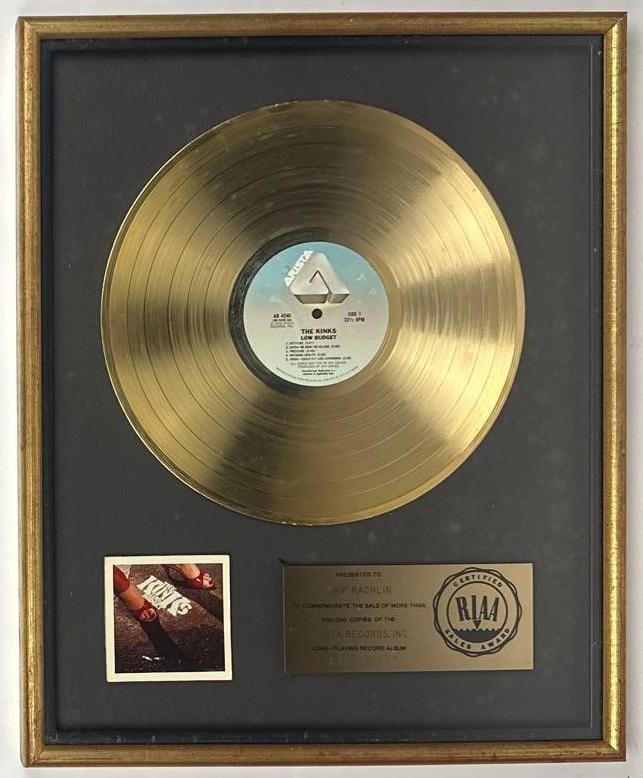The Kinks "Low Budget" RIAA Gold Sales Award Presented to Chip Rachlin: RIAA Certified Gold Sales Award presented to Chip Rachlin to commemorate the sale of more than 500,000 copies of the Arista Records album "Low Budget" by The Kinks. The framed display, measuring appro