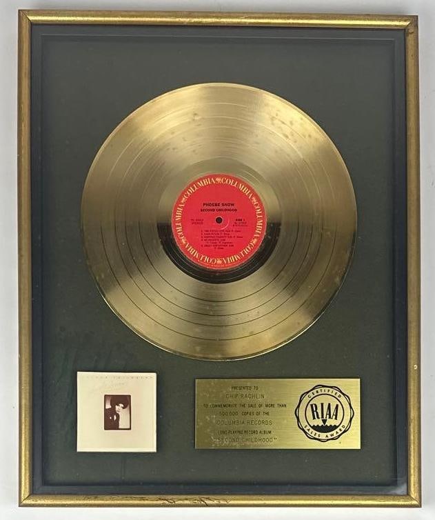 Phoebe Snow "Second Childhood" RIAA Gold Sales Award Presented to Chip Rachlin: RIAA Certified Gold Sales Award presented to Chip Rachlin to commemorate the sale of more than 500,000 copies of the Columbia Records album "Second Childhood" by Phoebe Snow. The framed display, measu