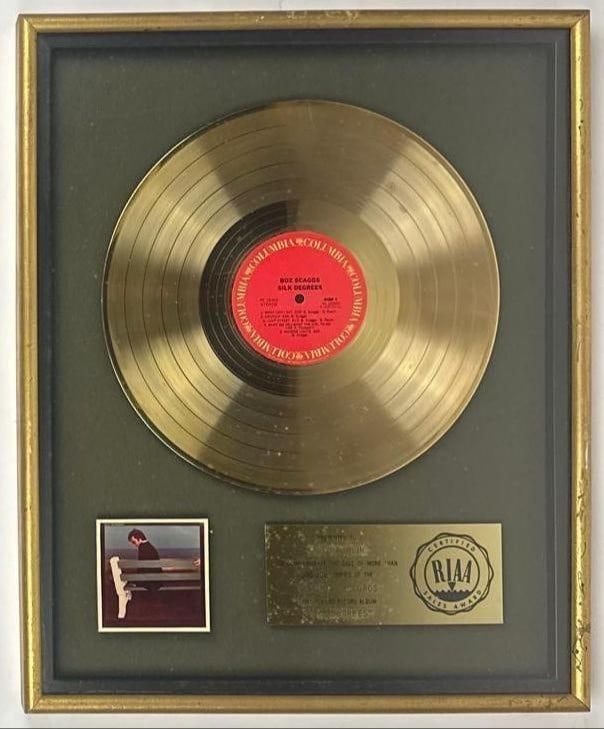 Boz Scaggs "Silk Degrees" RIAA Gold Sales Award Presented to Chip Rachlin: RIAA Certified Gold Sales Award presented to Chip Rachlin to commemorate the sale of more than 500,000 copies of the Columbia Records album "Silk Degrees" by Boz Scaggs. The framed display, measuring 