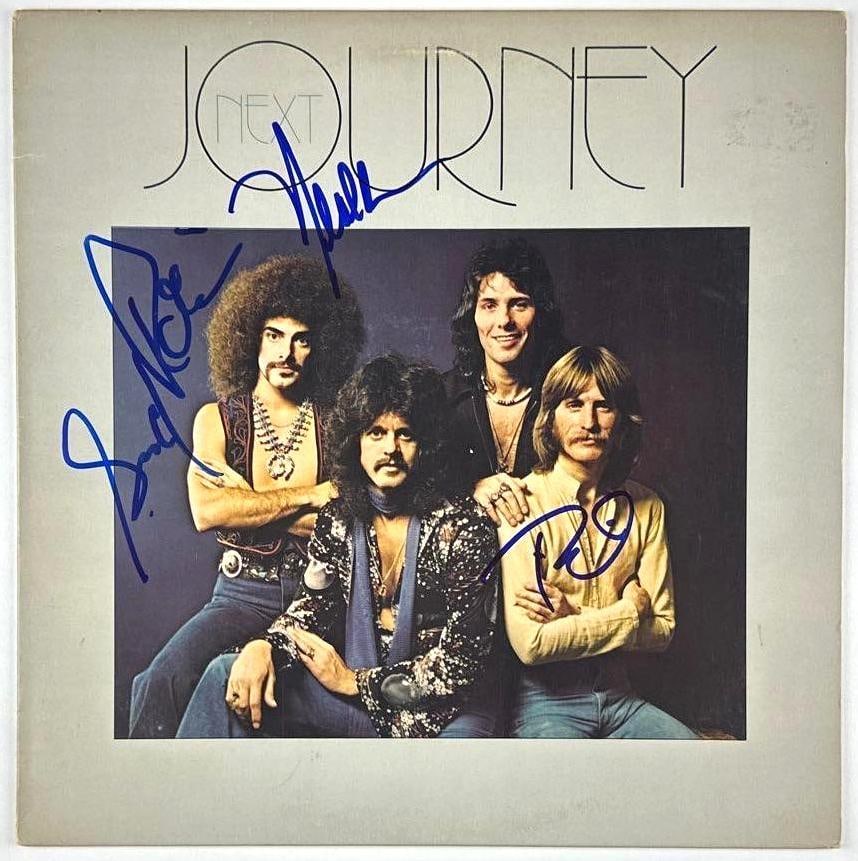 Journey Group Signed "Next Journey" Album (3 Sigs) (JSA Authentication): "Next Journey" album signed on the cover in blue felt tip marker by Journey band members Neal Schon, Gregg Rolie, and Ross Valory. Measuring approximately 12" x 12" and in very good condition, with so