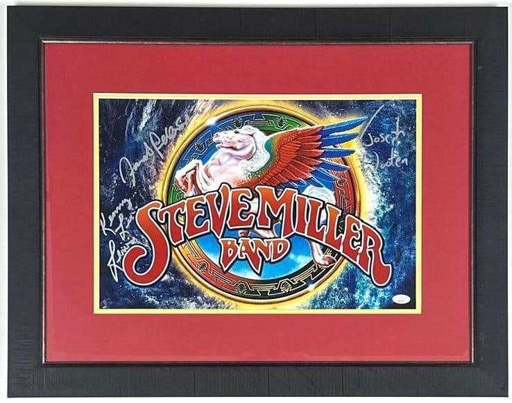 Steve Miller Band Group Signed 12" x 17" Band Logo Photo (3 Sigs) (JSA): Color 12" x 17" band logo photo framed display signed in silver felt tip marker by Steve Miller band band members Kenny Lee Lewis, Joseph Wooten, and Jacob Petersen. Signed photo measures