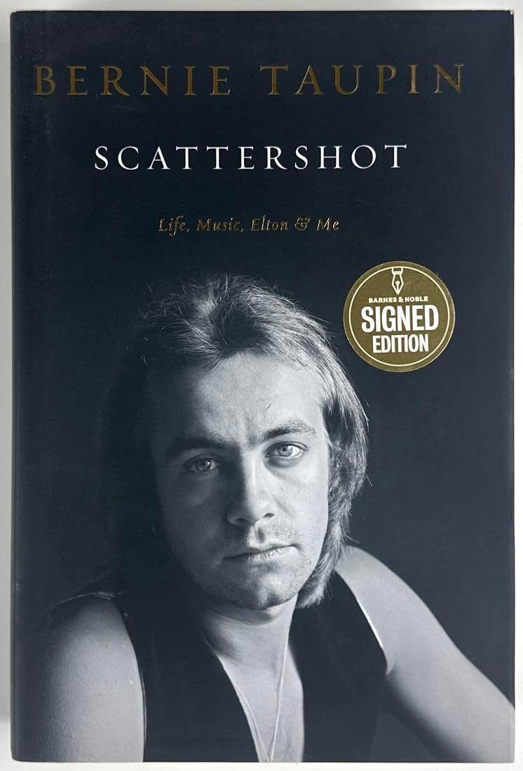Bernie Taupin Signed "Scattershot: Life, Music, Elton & Me" Book (Third Party Guaranteed): Black-and-white hardcover 9.75" x 6.75" "Scattershot: Life, Music, Elton & Me" book signed on the inside front page in black ballpoint pen by musician Bernie Taupin. In fine condition. Provenance