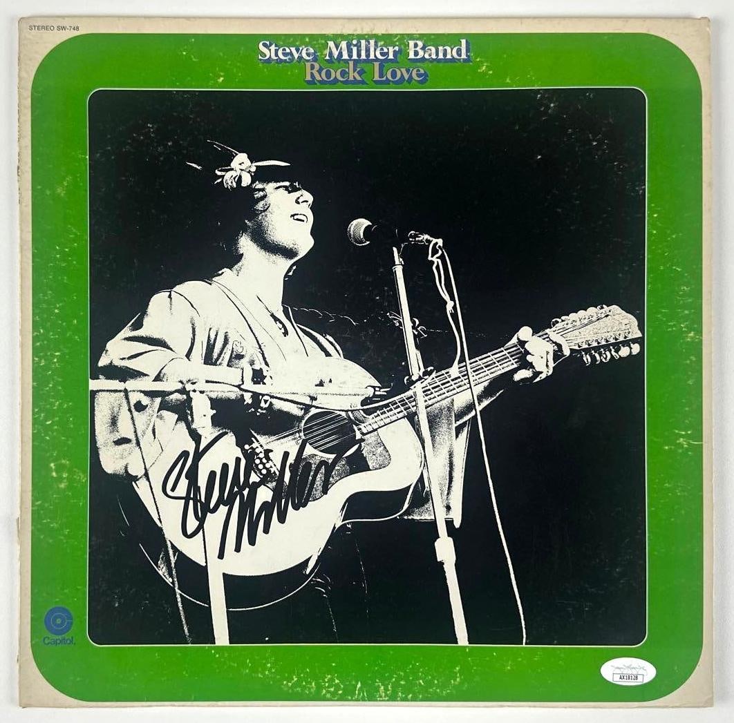 Steve Miller Signed Steve Miller Band "Rock Love" Album (JSA Authentication): "Rock Love" album signed on the front cover in black felt tip marker by Steve Miller. Measuring approximately 12" x 12" and in fair to good condition with noticeable edge wear, corner creasing, and