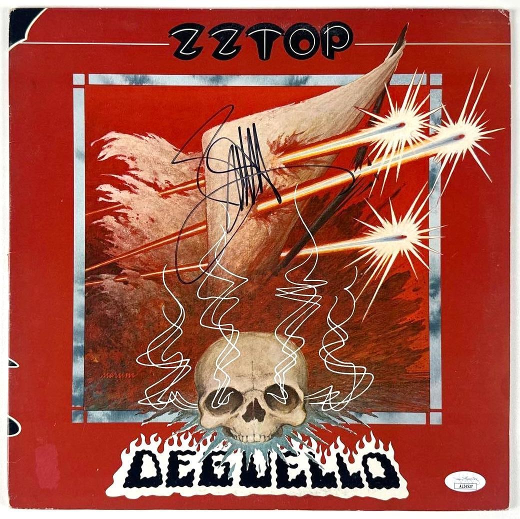 Billy Gibbons Signed ZZ Top "Deguello" Album (JSA Authentication): "Deguello" album signed on the cover in black felt tip marker by ZZ Top band member Billy Gibbons. Measuring approximately 12" x 12" and in good condition with minor wear to the edges and corners.