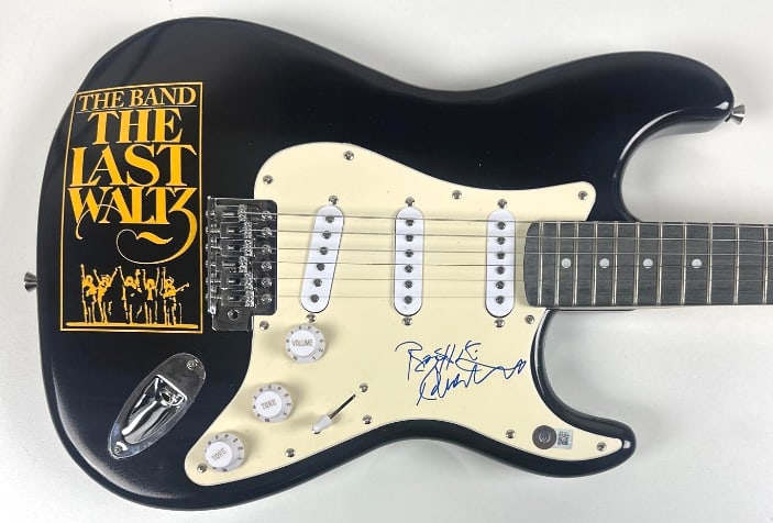 The Band: Robbie Robertson Signed "The Last Waltz" Graphics Stratocaster-Style Guitar (BAS): "The Last Waltz" custom graphics Stratocaster-style guitar signed on the pickguard in blue felt tip marker by The Band band member Robbie Robertson. Measuring approximately 39" x 17.5" and in fine con