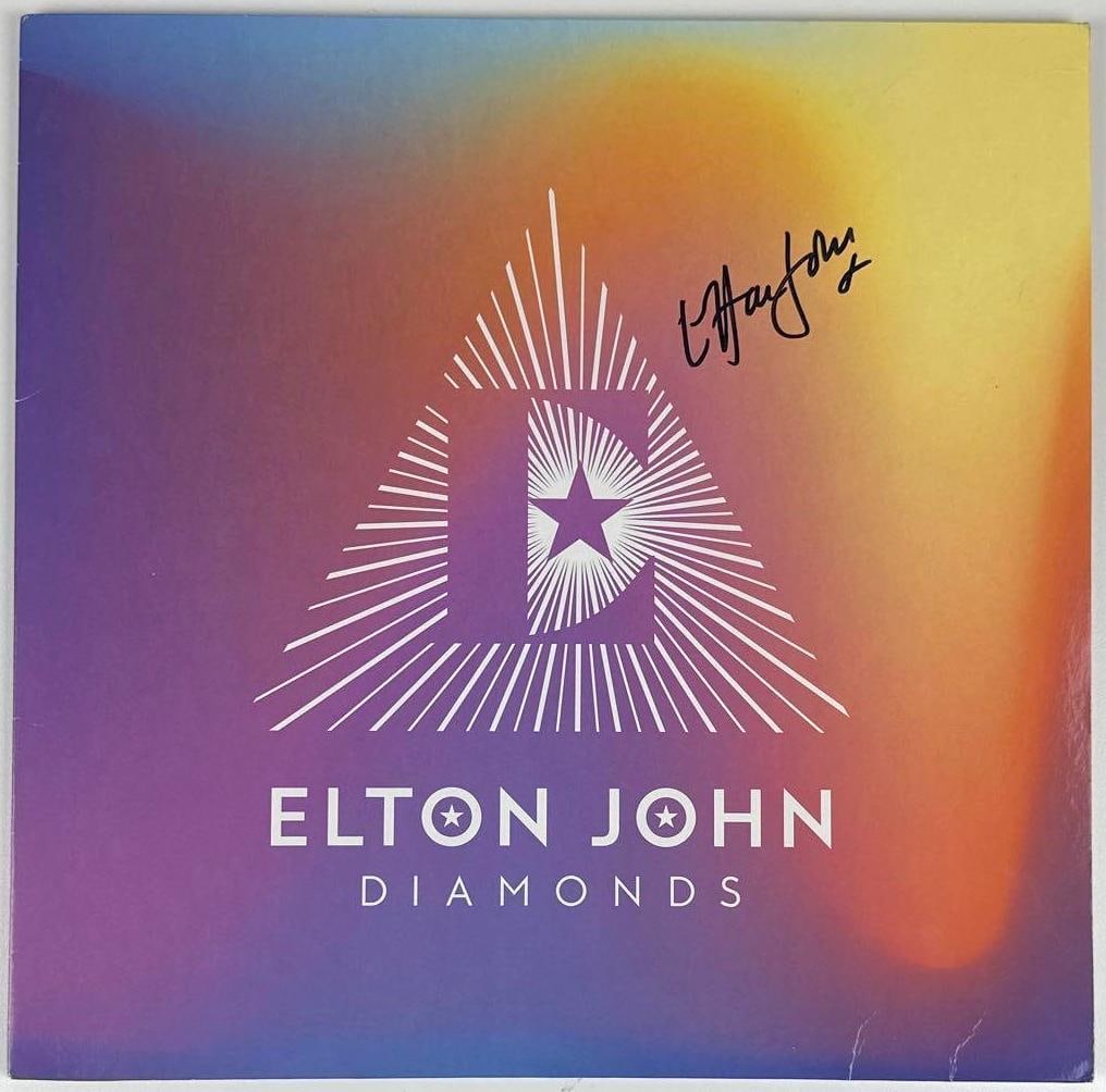 Elton John Signed "Diamonds" Album (JSA Authentication): "Diamonds" album signed on the cover in black felt tip marker by musician Elton John. Measuring approximately 12" x 12" and in fine condition. Record is included. Authenticated by JSA, with their