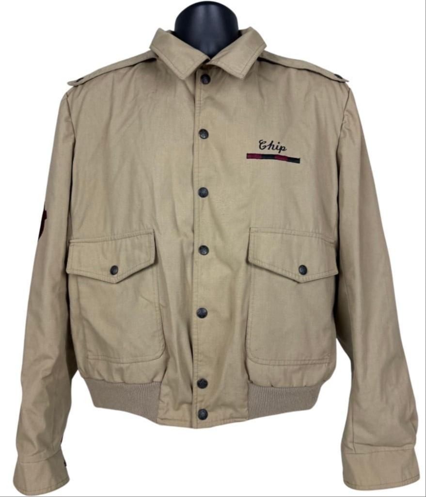 The Babys Vintage "Union Jacks 1980 Tour" Personalized Jacket (Chip Rachlin Collection): Vintage original LP Designs brand tan, red, and black size mens large 25.25" x 23" the Babys "Union Jacks 1980 Tour" jacket, with the name "Chip" underlined in red and black stitched to the front left