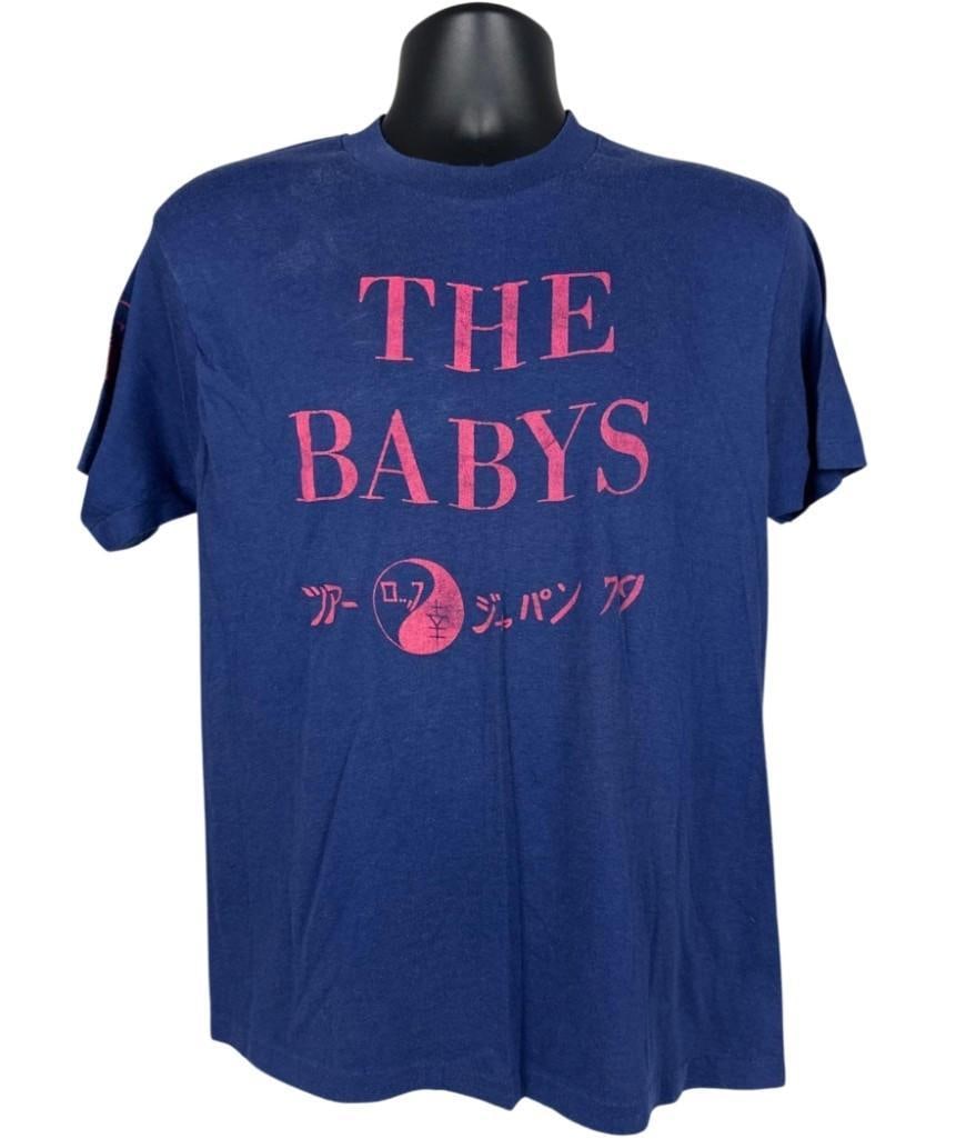 The Babys Vintage 1979 Japan Tour T-Shirt (Chip Rachlin Collection): Vintage original Hanes brand blue and pink size mens XL 27" x 20" "The Babys Tour Japan 79" t-shirt. The front features the bands name and a yin/yang graphic in Japanese text writing "Tour Japan" in