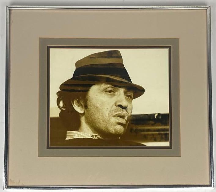 Bill Graham Vintage Original Framed 18.25" x 20.25" Photograph (Chip Rachlin Collection): Black-and-white portrait photograph of legendary concert promoter Bill Graham, framed and measuring approximately 18.25" x 20.25". The image captures Graham smoking a cigar in a candid pose. In very