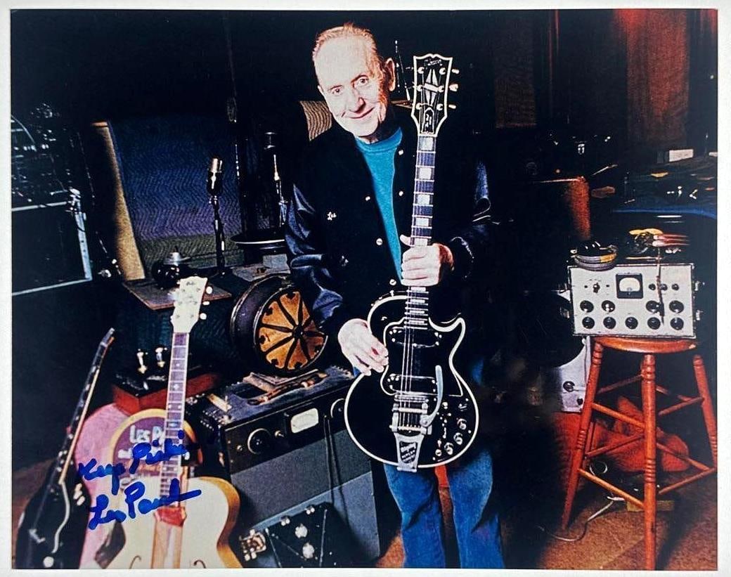 Les Paul Signed 8" x 10" Photo (JSA Authentication): Color 8" x 10" photo signed in blue felt tip marker by musician and guitarist Les Paul, who inscribed "Keep picking" before his signature. In fine condition. Authenticated by JSA. Provenance This