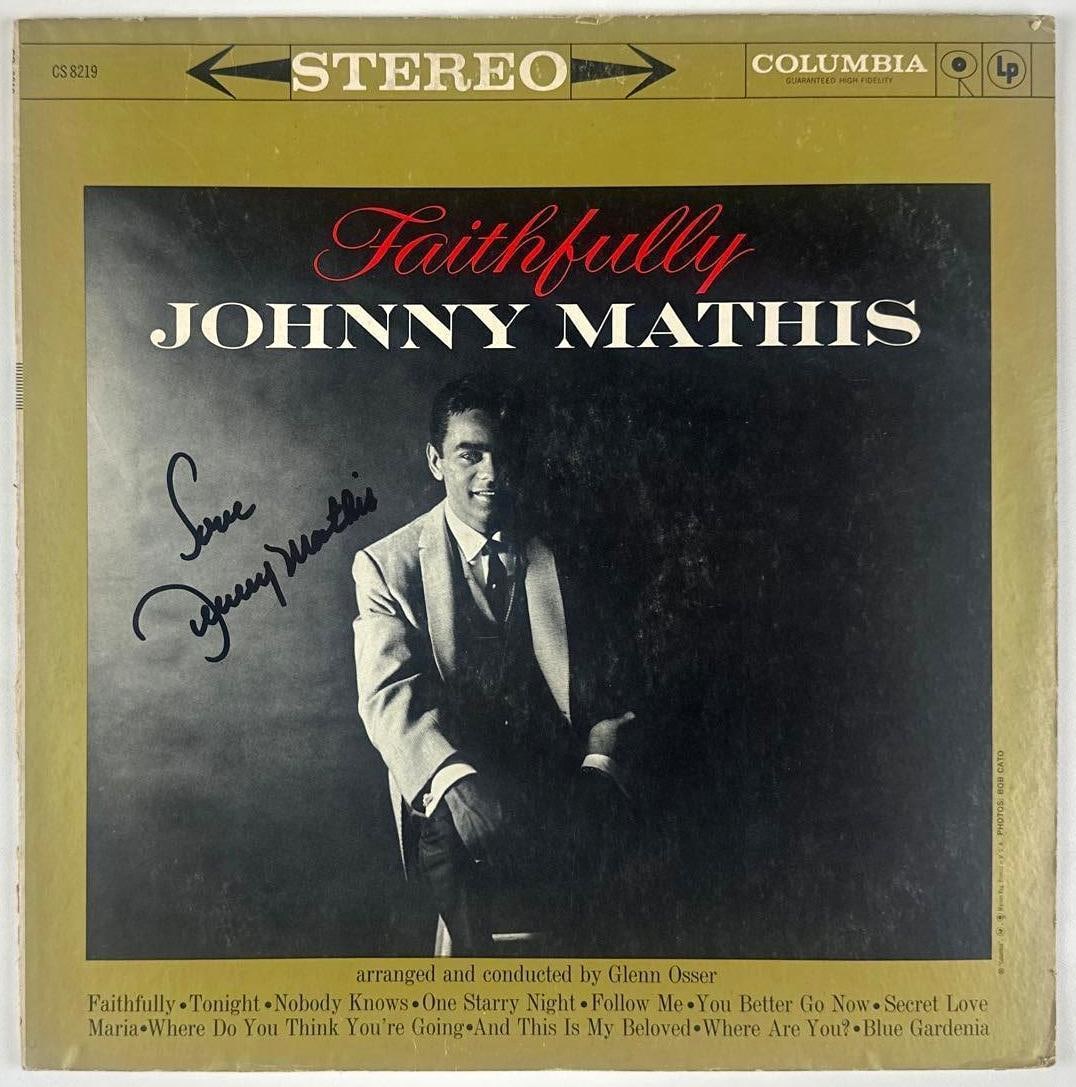 Johnny Mathis Signed "Faithfully" Album (JSA Authentication): "Faithfully" album signed on the cover in black felt tip marker by pop legend Johnny Mathis (inscribed "Love"). Measuring approximately 12" x 12" and in good condition with some signs of scattered