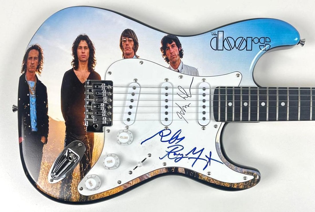 The Doors Group Signed "Waiting for the Sun" Custom Graphics Strat-Style Guitar (3 Sigs) (JSA Auth.): "Waiting for the Sun" custom graphics Stratocaster-style guitar signed on the pickguard in blue and black felt tip markers by The Doors band members Ray Manzarek, John Densmore, and Robby Krieger.