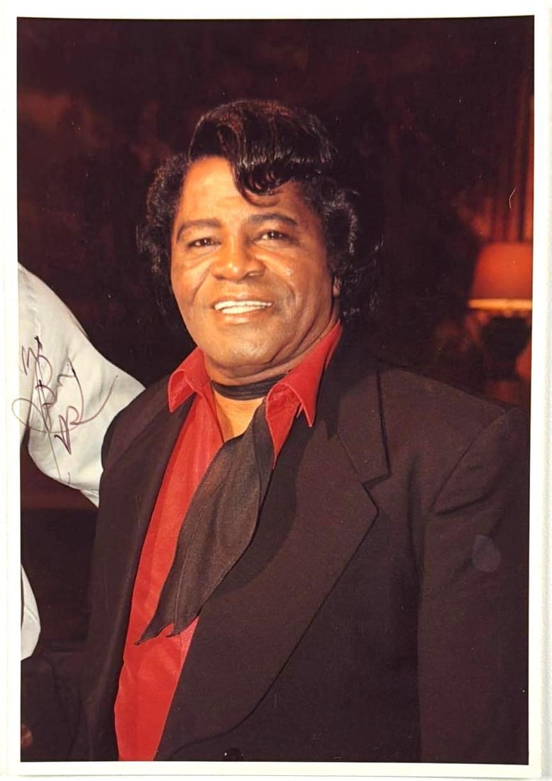 James Brown Signed 8.5" x 6" Photo (JSA Authentication): Color 8.5" x 6" photo signed in black felt tip marker by musician James Brown. In fine condition. Accompanied by a full Letter of Authenticity from JSA (#YY12414).