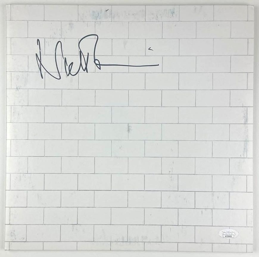Nick Mason Signed Pink Floyd "The Wall" Album (JSA Authentication): "The Wall" album signed on the cover in black felt tip marker by Pink Floyd drummer Nick Mason. Measuring approximately 12" x 12" and in good condition with some signs of light scattered wear.