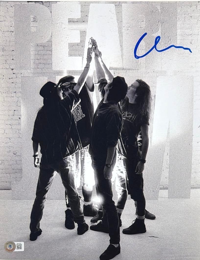 Pearl Jam: Dave Krusen Signed 14" x 11" Photo (Beckett Authenticaiton): Color 14" x 11" photo signed in blue felt tip marker by Pearl Jam band member Dave Krusen. In fine condition. Authenticated by Beckett, with their official hologram affixed to the front bottom left
