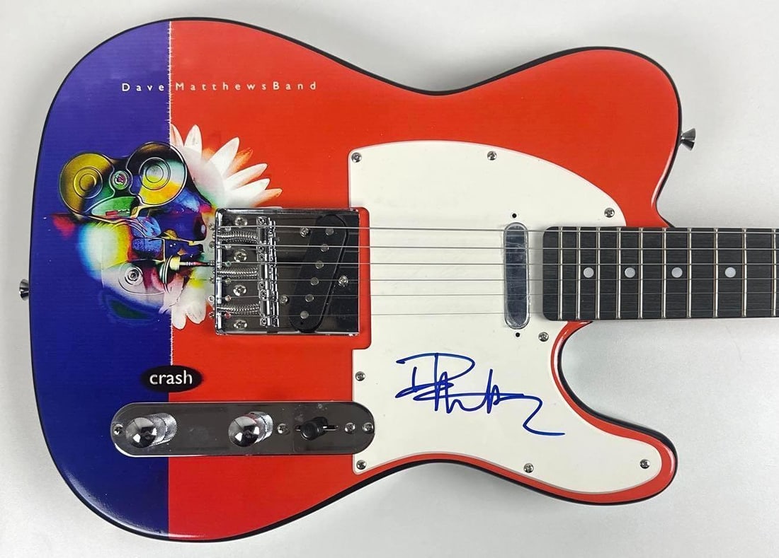 Dave Matthews Signed "Crash" Custom Graphics Telecaster-Style Guitar (JSA Authentication): "Crash" custom graphics Telecaster-style guitar signed on the pickguard in blue felt tip marker by musician Dave Matthews. Measuring approximately 39" x 12.5" and in fine condition. Accompanied by a