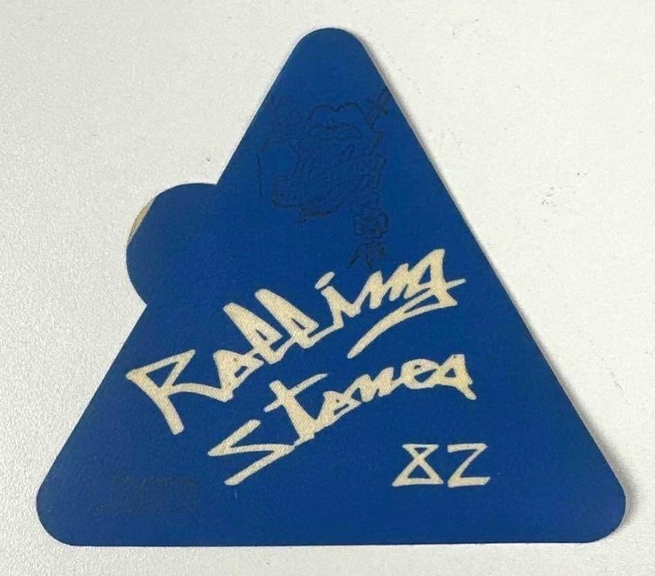 The Rolling Stones Vintage "82" Back Stage Pass (Chip Rachlin Collection): Vintage original blue and white 4.5" x 4.5" Rolling Stones "82" back stage pass. One side features the band name and "82" in white stylized font, along with a faint image of the tongue sticking-out