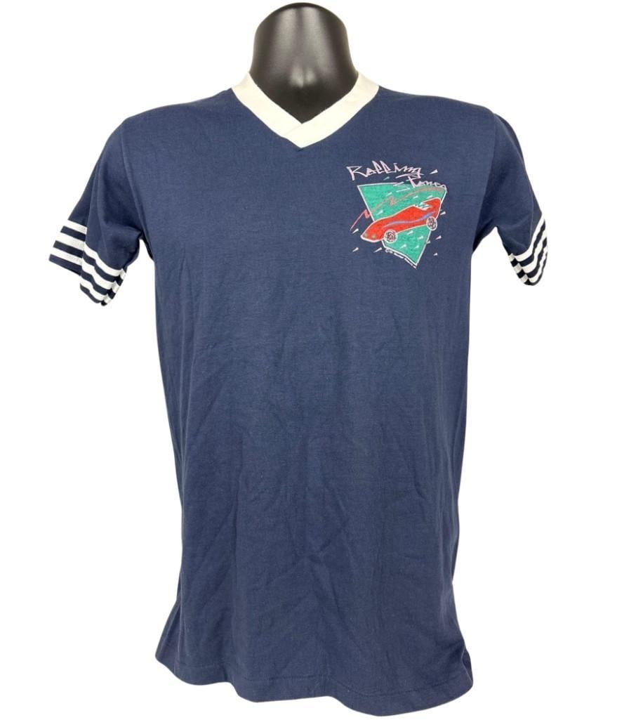 The Rolling Stones Vintage "American Tour 1981" T-Shirt (Chip Rachlin Collection): Vintage original Downerwear brand blue, green, white, and red mens size medium 27" x 17" "American Tour 1981" Rolling Stones t-shirt. The front right breast has an illustrated red car in a green