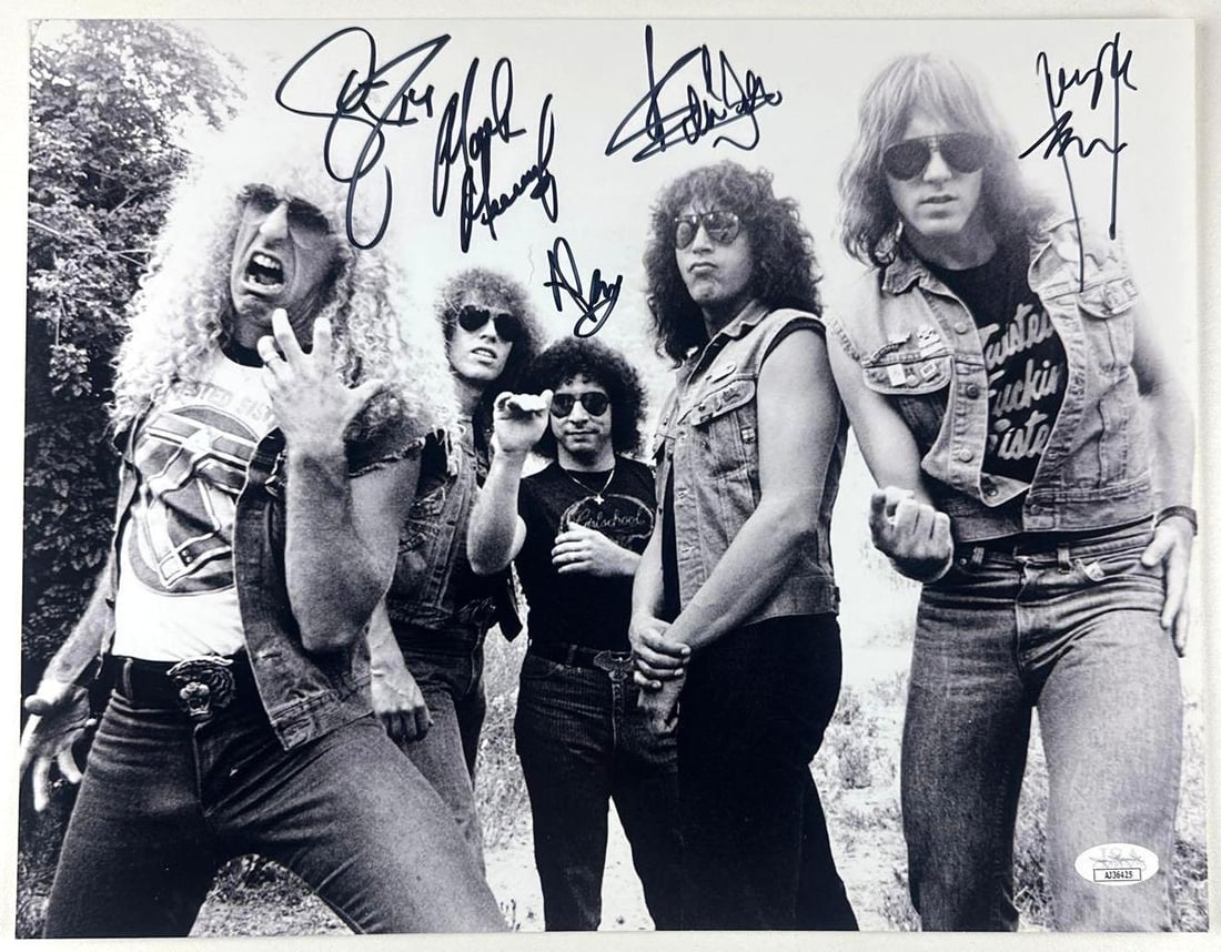 Twisted Sister Fully Group Signed 11" x 14" Photo (5 Sigs) (JSA Authentication): Black-and-white 11" x 14" photo signed in black felt tip marker by Twisted Sister band members Dee Snider, Mark Mendoza, Jay Jay French, Eddie Ojeda, and A.J. Pero. In fine condition. Authenticated by