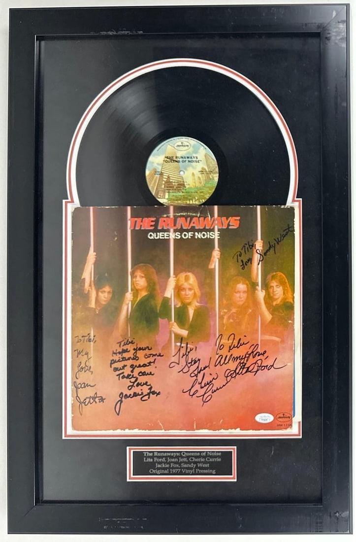 The Runaways Group Signed "Queens of Noise" Album Framed (5 Sigs) (JSA): Rare The Runaways 1977 Queens of Noise album signed on the cover in black felt tip marker by all five members of the band: Joan Jett, who inscribed "To Tibi, My love"; Lita Ford, who inscribed "To